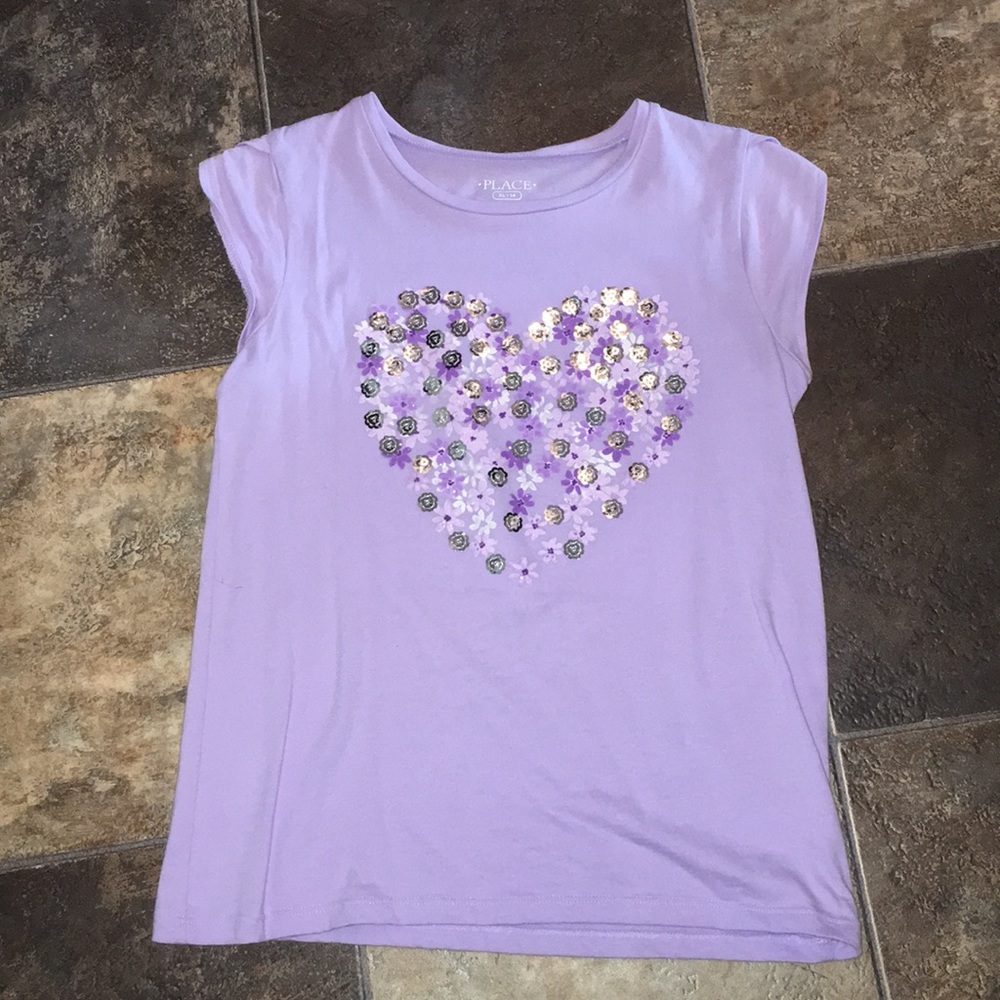 Light purple top with a matching skirt.
